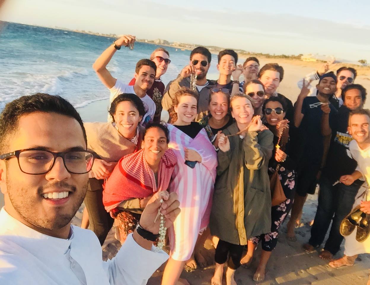 Br Sheldon Burke CRS and the youth takes some time to pray the Holy Rosary along Coogee Beach. Photo: Br Sheldon Burke CRS